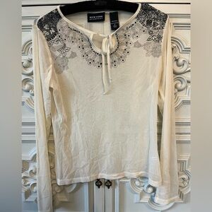 Cream sheer blouse with black flower detail
